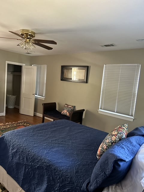 Nashville Room - walk-in closet, laundry basket, bench, rug.