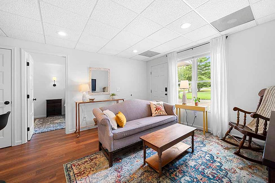 Living Area facing Entry Door and Double Windows