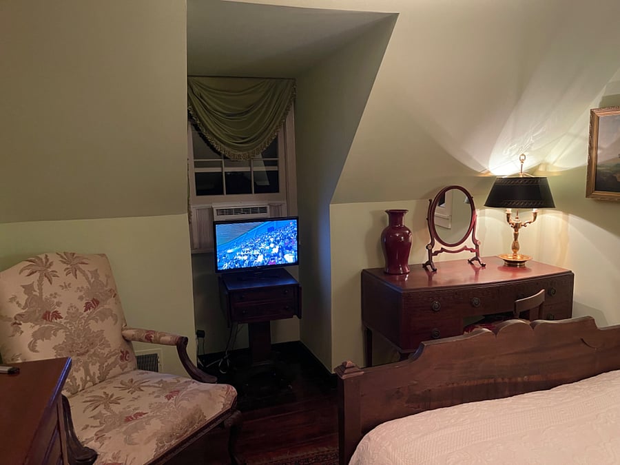 Bedroom with Smart TV and arm chair