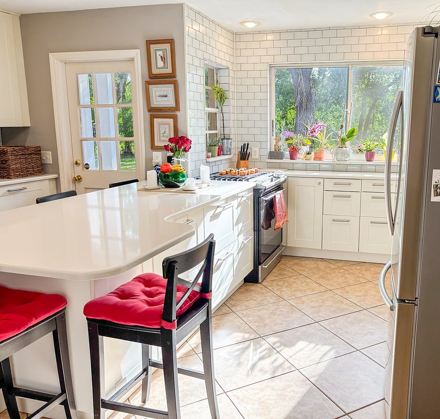 Full kitchen with gas range and a peaceful view of the backyard.