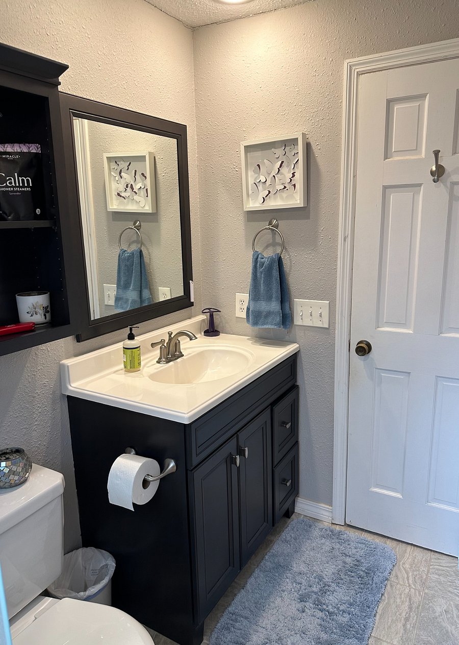 Your private bath includes starter toiletries. Cleaning products are under the sink