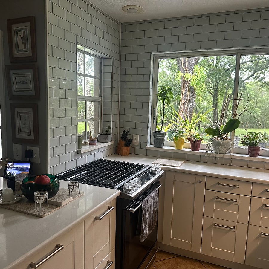 Kitchen has gas stove and oven with nice window into backyard