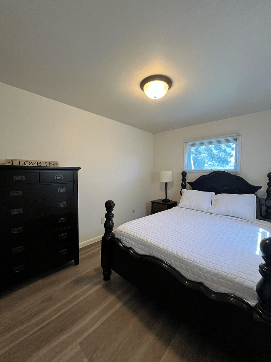 Bedroom 1- has queen bed and dresser for storage. Also has closet for storage as well.