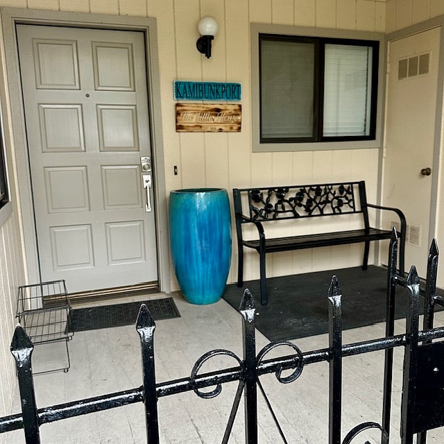 Fenced in entryway patio