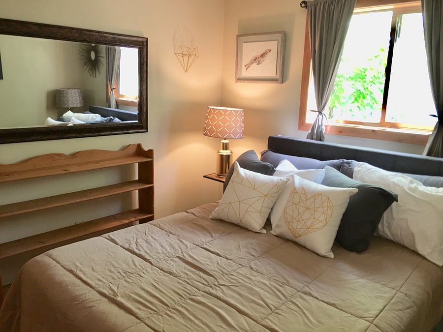 Shelving in Bedroom with window and fan