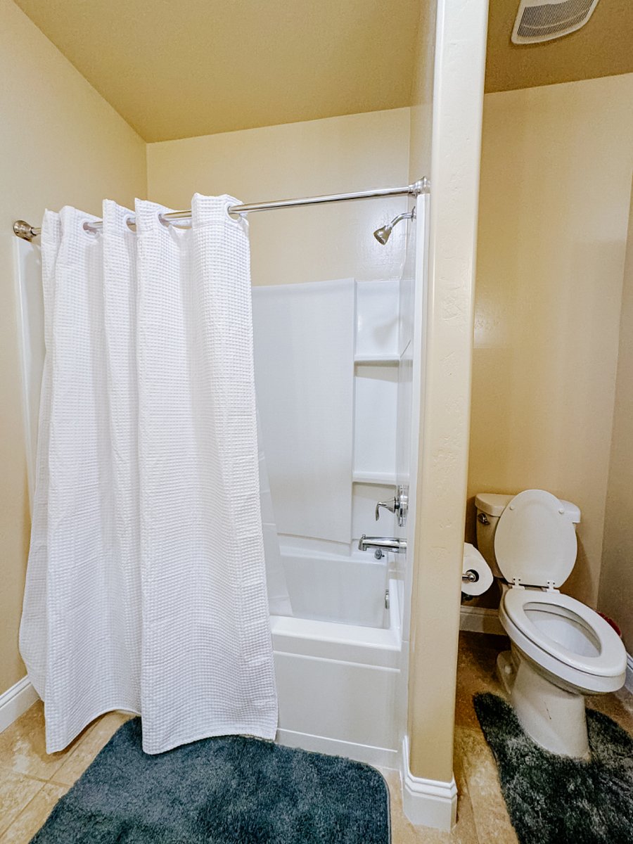 shared bathroom tub with shower