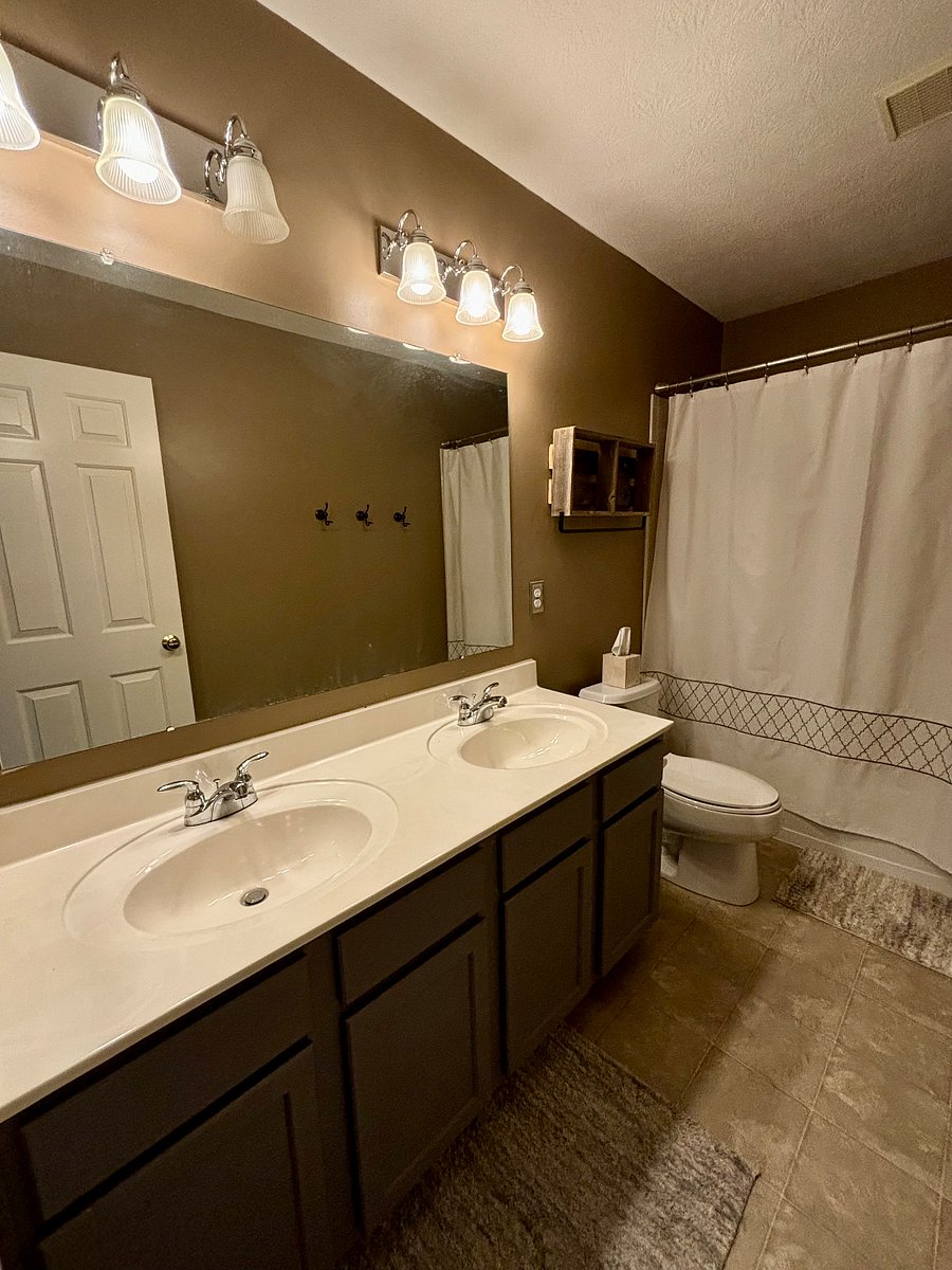 Your private bath with double vanities and ample countertop space.