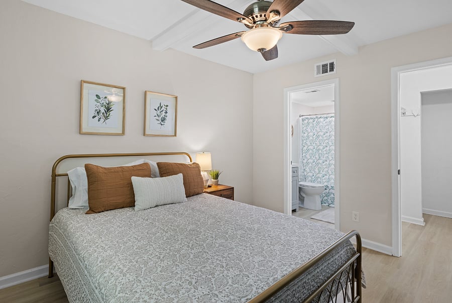 The bedroom features a cozy queen bed, Smart TV and an ensuite full bathroom, providing a comfortable and private retreat.