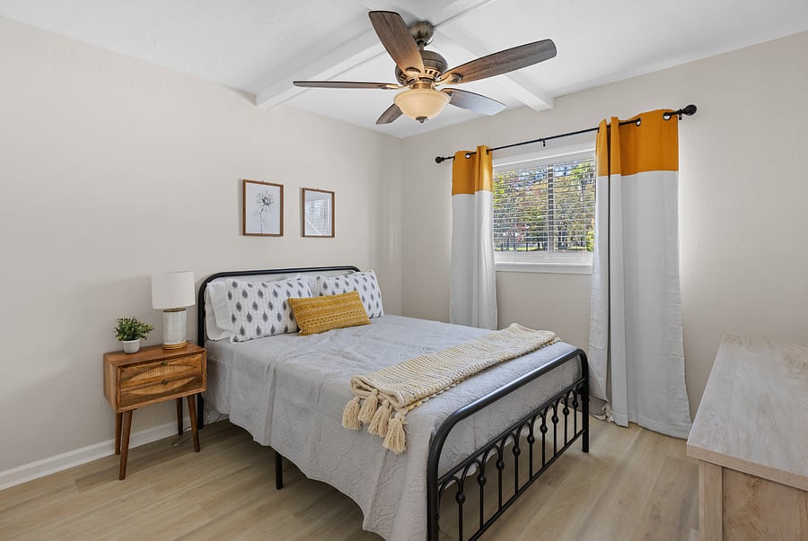 Bedroom 2 features a cozy queen bed and full bathroom, providing a comfortable and private retreat.