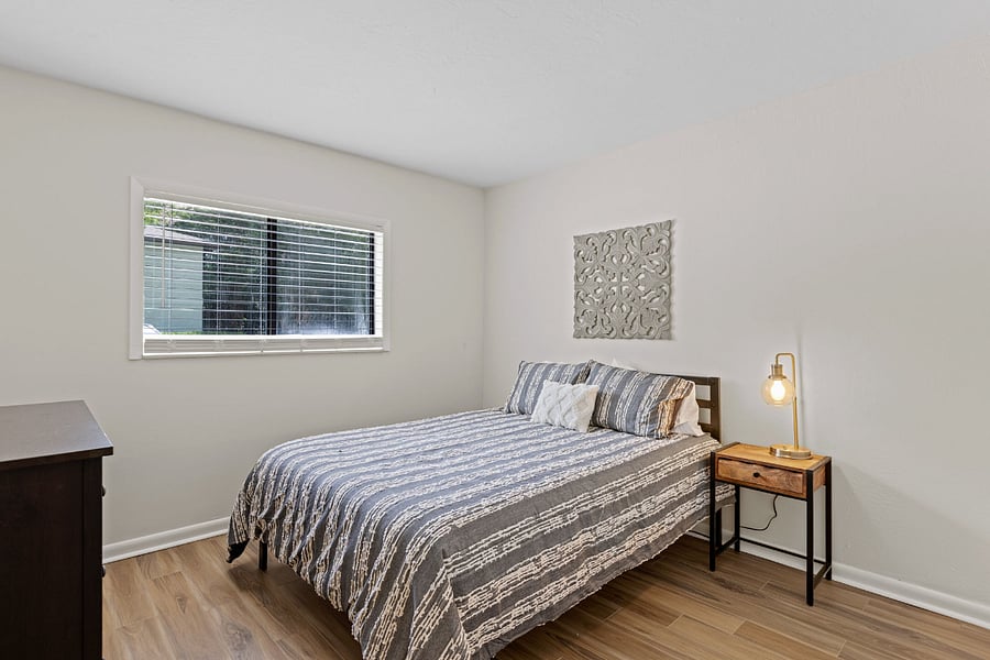 The second bedroom is elegantly furnished with a cozy queen bed and an ensuite bathroom, providing a private and comfortable retreat.