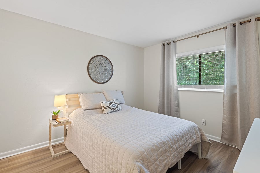 The bedroom features a comfortable queen bed and is equipped with a smart TV, offering a perfect spot to unwind and enjoy your favorite shows.






