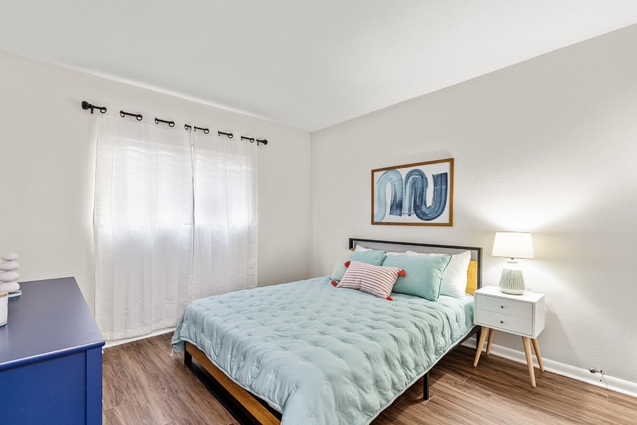 Bedroom 2 features a comfortable queen bed, providing a peaceful and restful space for guests.
