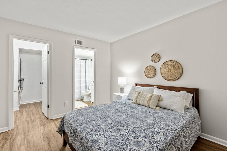 Bedroom 1 features a comfortable queen bed and is equipped with a smart TV, providing a cozy retreat for relaxation and entertainment.