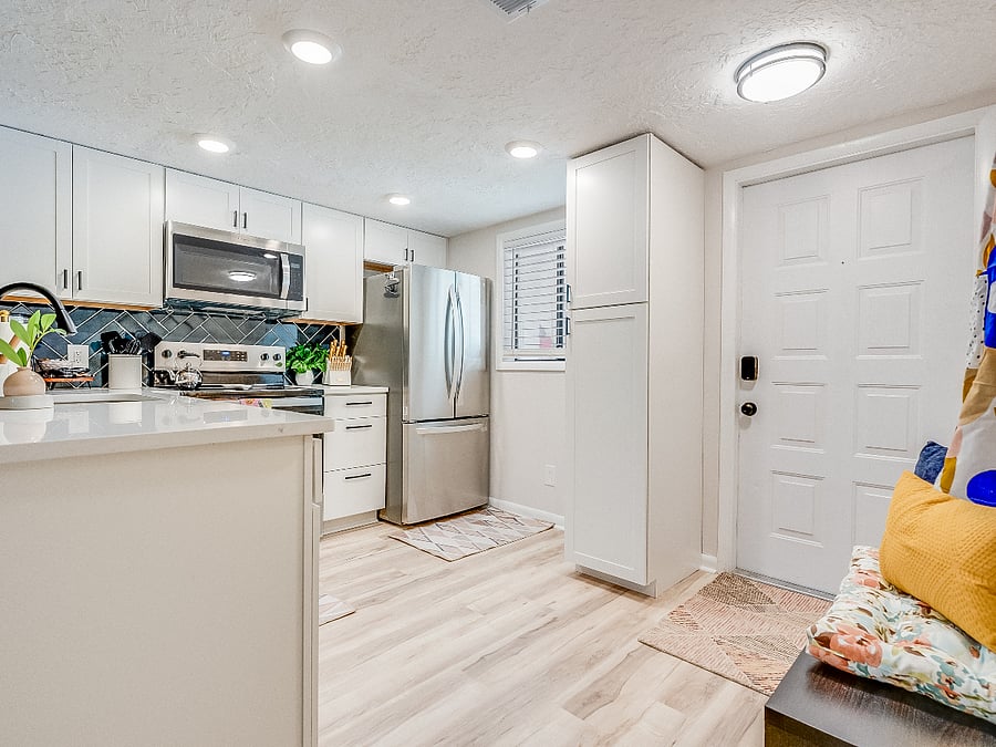 The kitchen at Bluffside Charm is a chefs dream, featuring modern appliances, ample counter space, and all the essentials you need to prepare delicious meals during your stay.