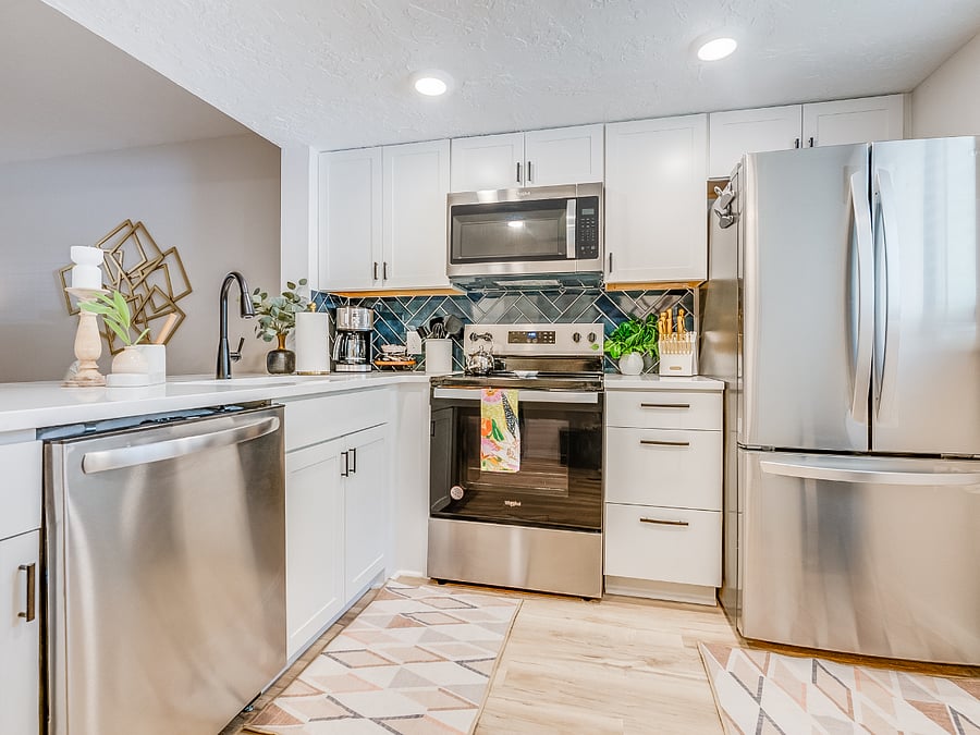 The kitchen at Bluffside Charm is a chefs dream, featuring modern appliances, ample counter space, and all the essentials you need to prepare delicious meals during your stay.