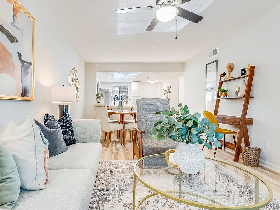 The living room at Bluffside Charm is a cozy haven, designed for relaxation and entertainment. It features plush seating, warm lighting, and a large smart TV, perfect for streaming your favorite shows or enjoying a movie night after a day of exploring Savannah.