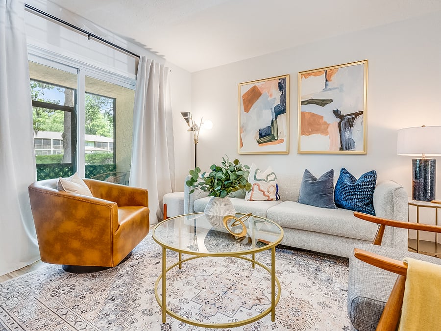 The living room at Bluffside Charm is a cozy haven, designed for relaxation and entertainment. It features plush seating, warm lighting, and a large smart TV, perfect for streaming your favorite shows or enjoying a movie night after a day of exploring Savannah.