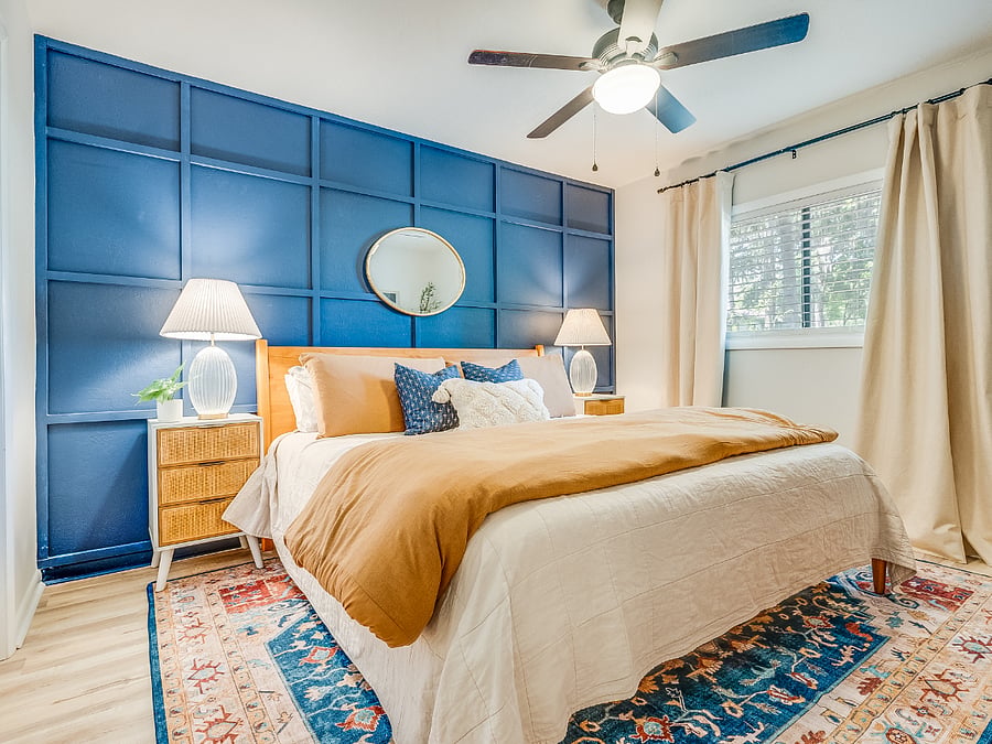 The primary bedroom at Bluffside Charm is a peaceful oasis, complete with a plush queen bed, an ensuite bath, and a smart TV, perfect for unwinding in comfort and style.