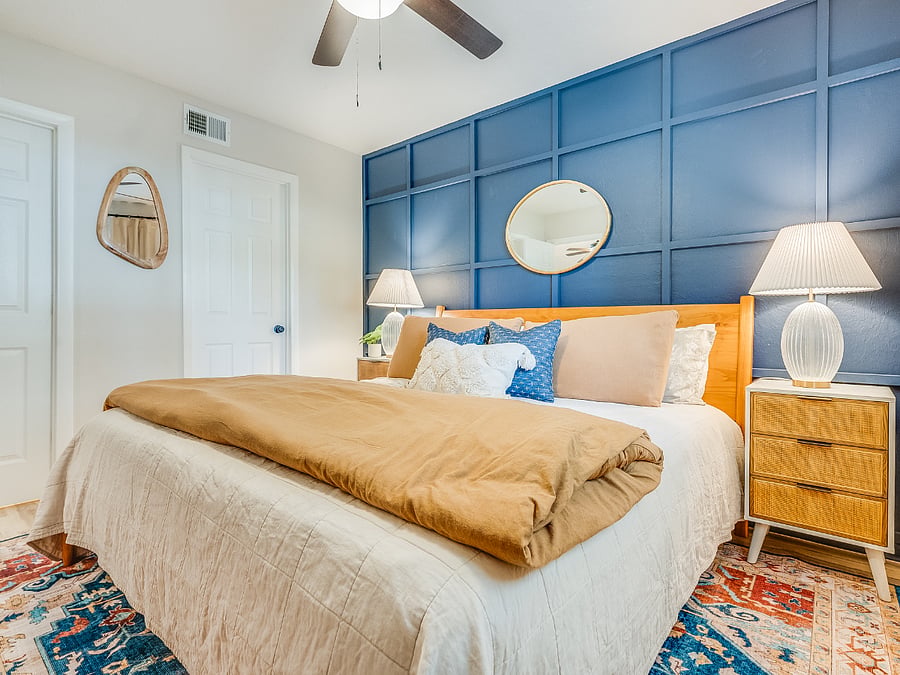 The primary bedroom at Bluffside Charm is a peaceful oasis, complete with a plush queen bed, an ensuite bath, and a smart TV, perfect for unwinding in comfort and style.