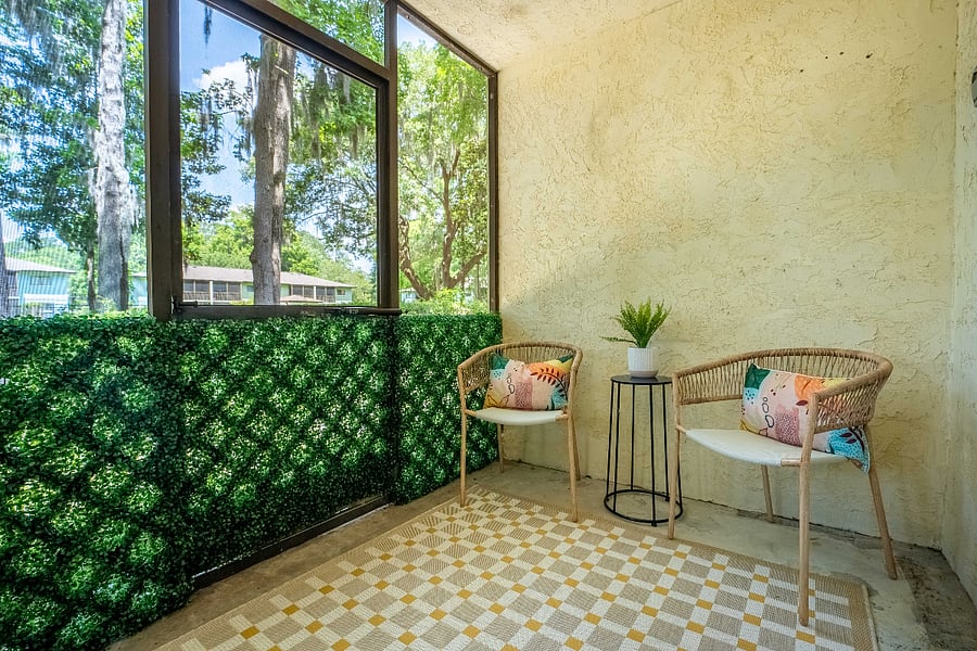Enjoy the tranquil outdoors at Bluffside Charm on the screened porch, where comfortable seating invites you to relax and savor Savannah's southern charm, whether you're sipping your morning coffee or winding down in the evening.