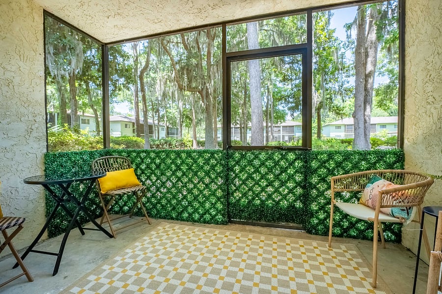 Enjoy the tranquil outdoors at Bluffside Charm on the screened porch, where comfortable seating invites you to relax and savor Savannah's southern charm, whether you're sipping your morning coffee or winding down in the evening.