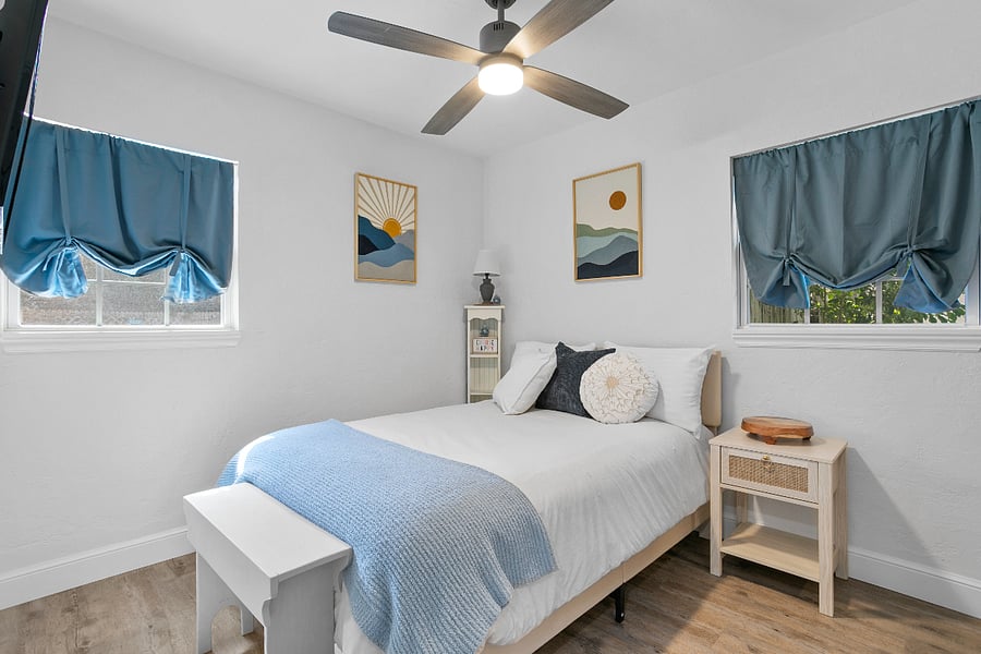 Downstairs- Bedroom 3 - Full bed. Includes room darkening curtains and smart tv.