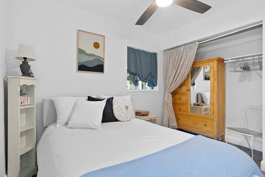 Downstairs- Bedroom 3 - Full bed. Includes room darkening curtains and smart tv.