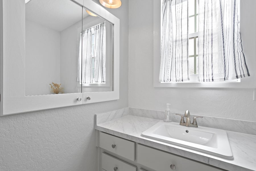 Upstairs- En Suite Bathroom. Stand up Shower and large mirrored cabinet.