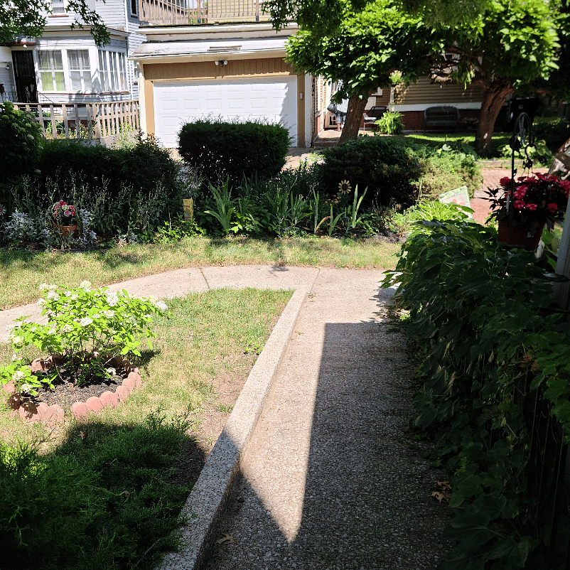Disembark from car to rear entry on ADA cement ramp attached to home.