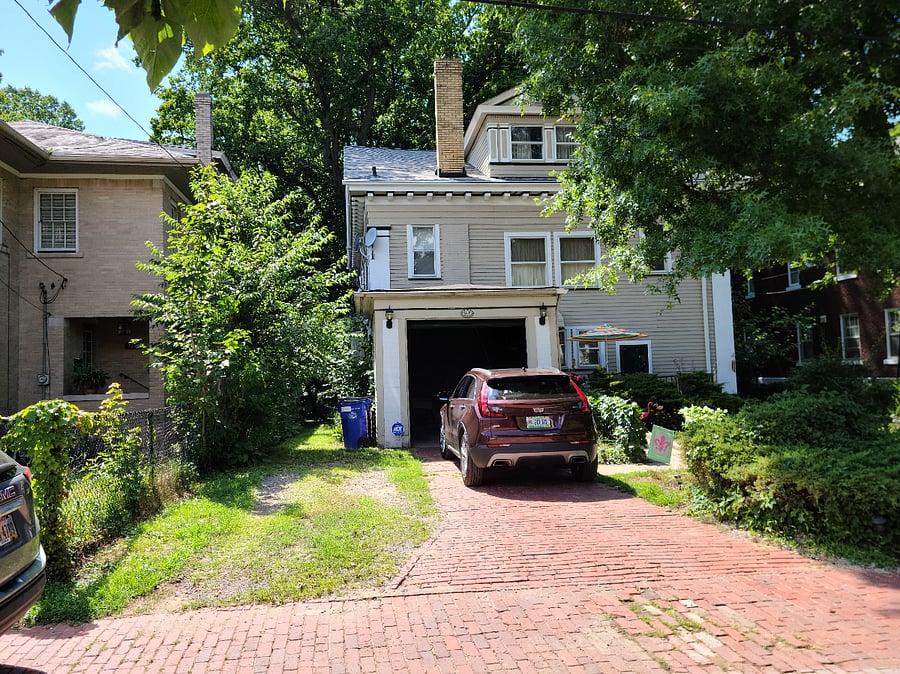 Rear of home (address on garage-Designated Parking on East 98th Place court-Left side of driveway