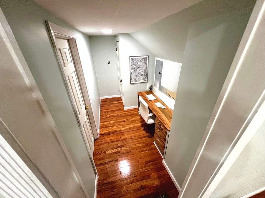 Hallway connecting the Livingroom to the 2nd Bedroom! It also features a 2nd entrance/exit! With easy access to the breaker.