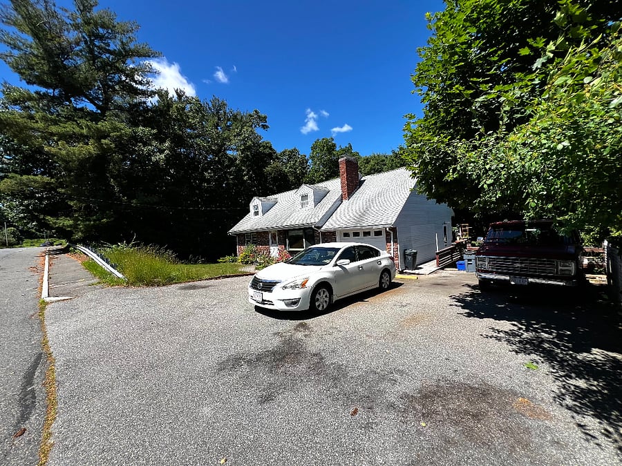 Picture of the entire house and driveway! There should be no parking issues what so ever with 2 dedicated driveway parking spots and nearly infinite street parking!
