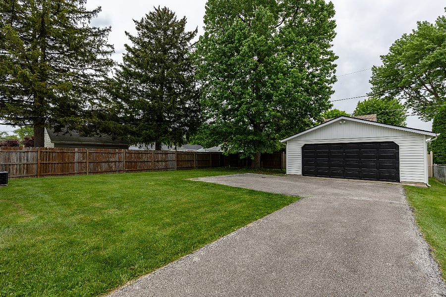 Fully fenced in backyard and parking area (garage currently unavailable at this time).