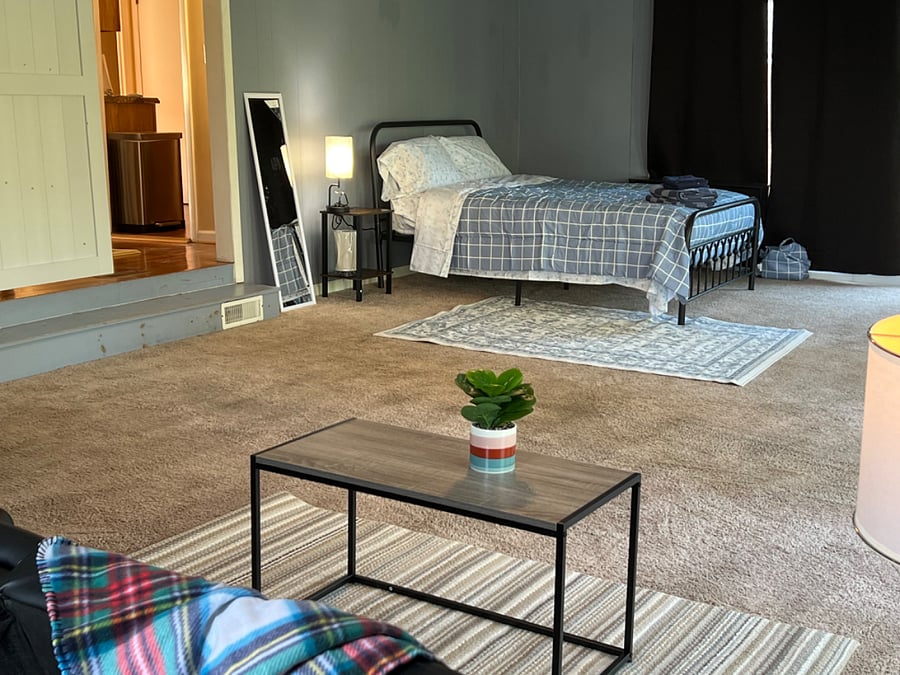 Bedroom #E -  Very large bedroom with Queen bed, sitting area, desk n chair, lots of natural light walkout to backyard deck. Private entry thru garage.Shared kitchen, Dining and bathroom. Personal refrigerator. Luxurious 