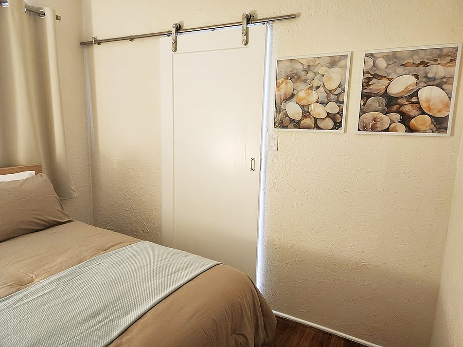 The bedroom can be closed off from the living area with a barn door.