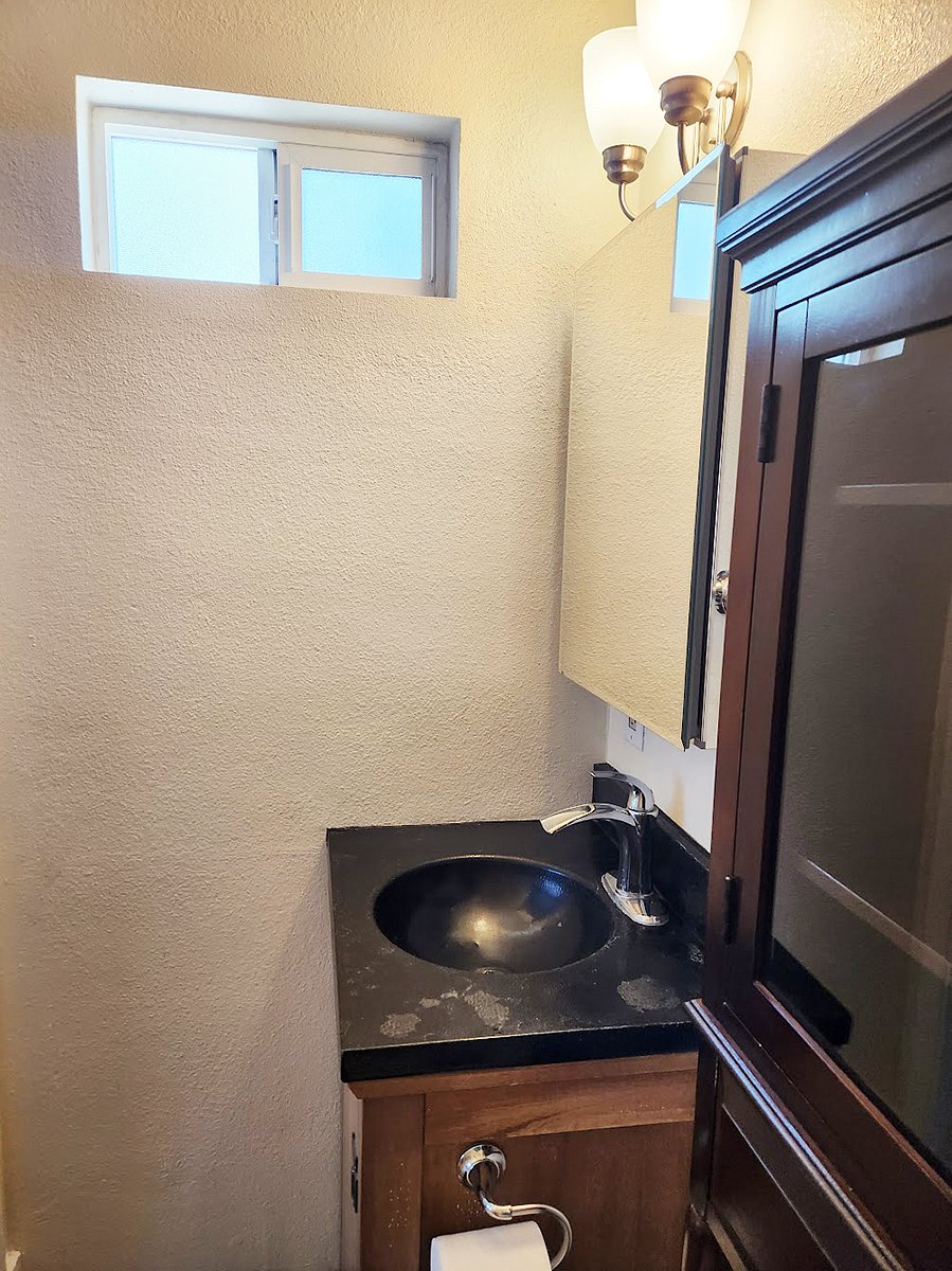 The bathroom has both window and exhaust fan.