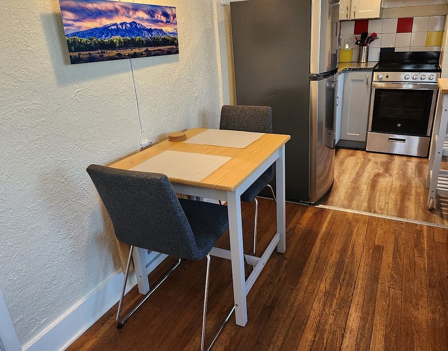 The dining table can be extended to twice its size for projects or additional company. The cushion covers on the chairs are washable