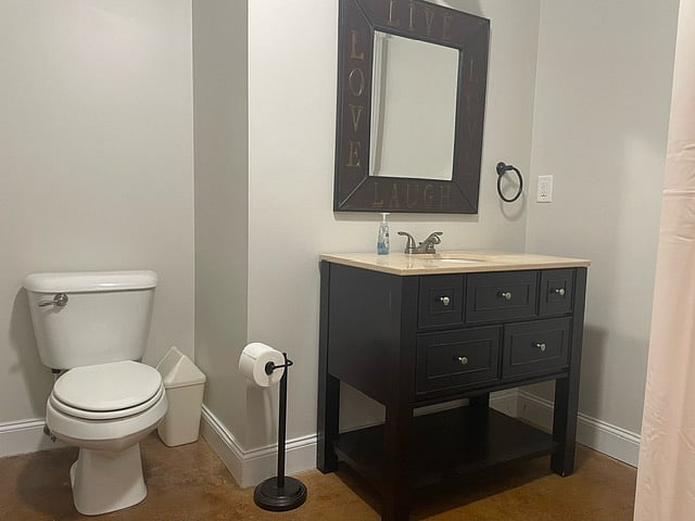 Bathroom with linen closet, vanity with great storage and plenty of towels.