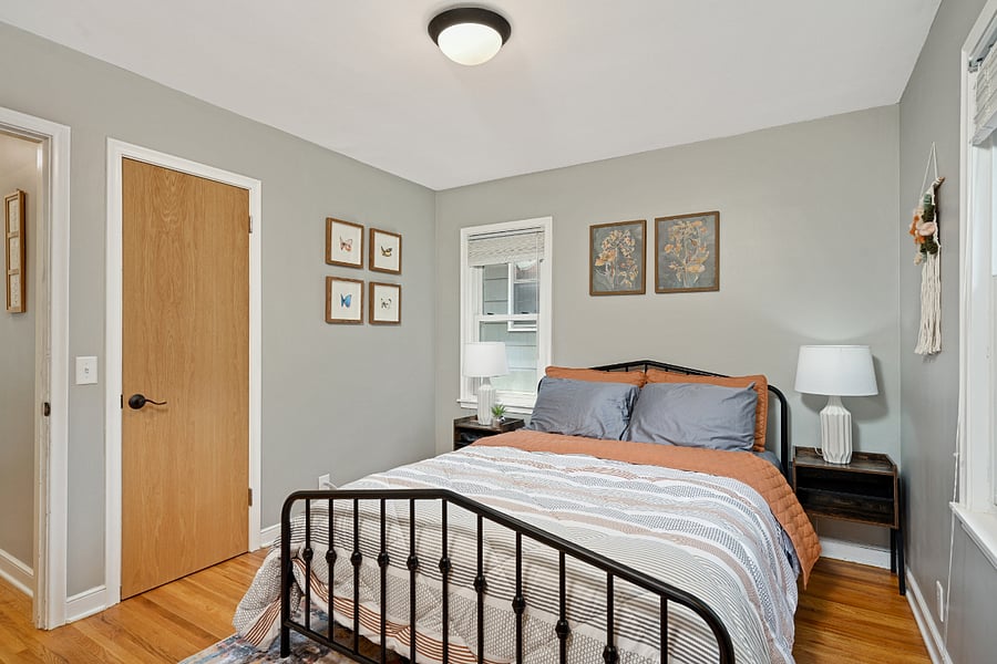 2nd bedroom, main floor, queen bed, smart TV mounted on wall