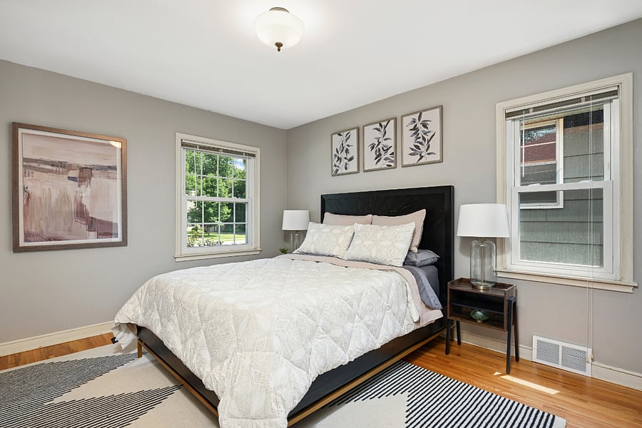 1st bedroom, main floor, queen bed, smart TV mounted on wall