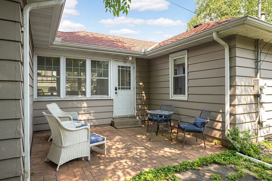 Backyard oasis with a paver patio for outdoor gatherings. The fenced yard is perfect for dogs!