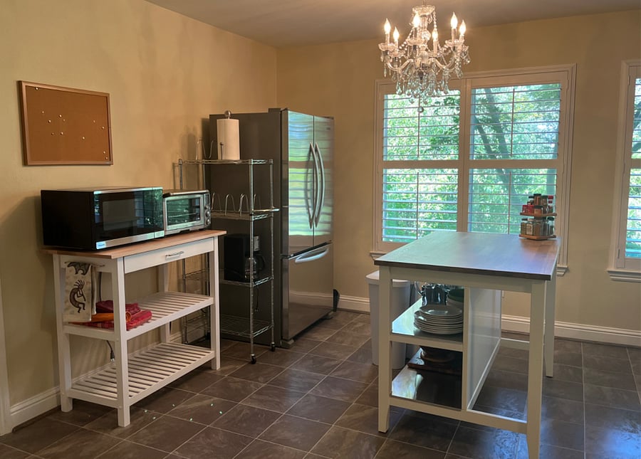 Half kitchen with full-size refrigerator, microwave and Breville oven