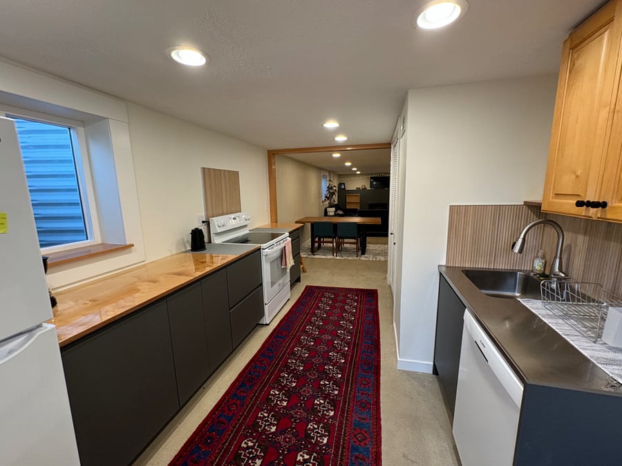 Kitchen looking into dining and living room area