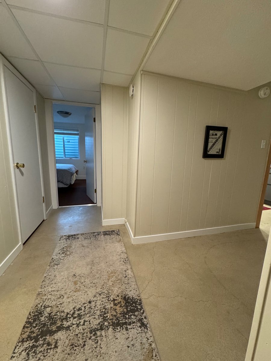 Hallway between bedroom, bathroom, and dining area