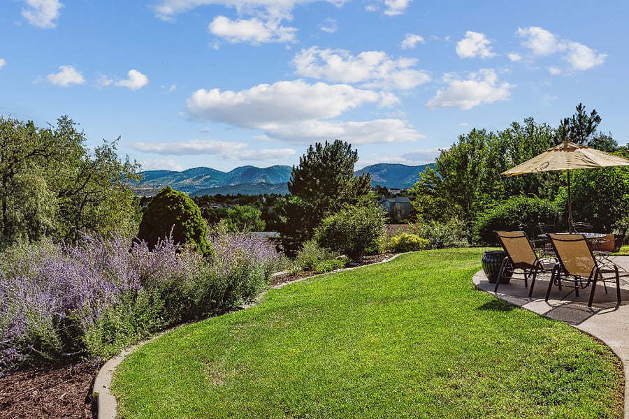 Part of fenced backyard with views