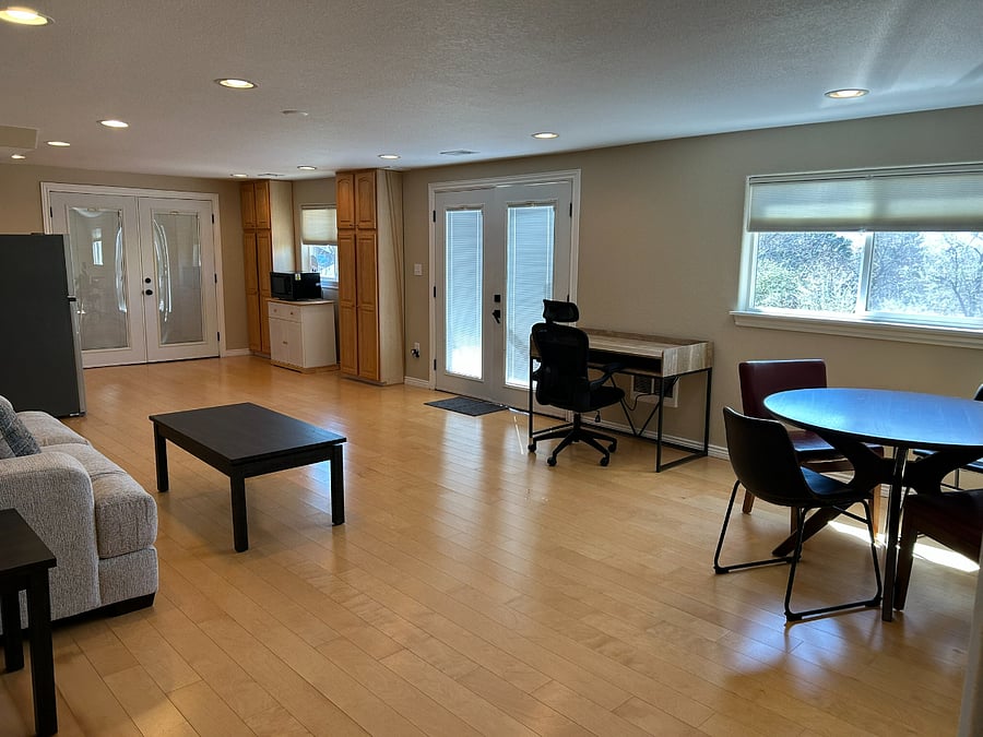 Open area walkout bsmt with new furniture 