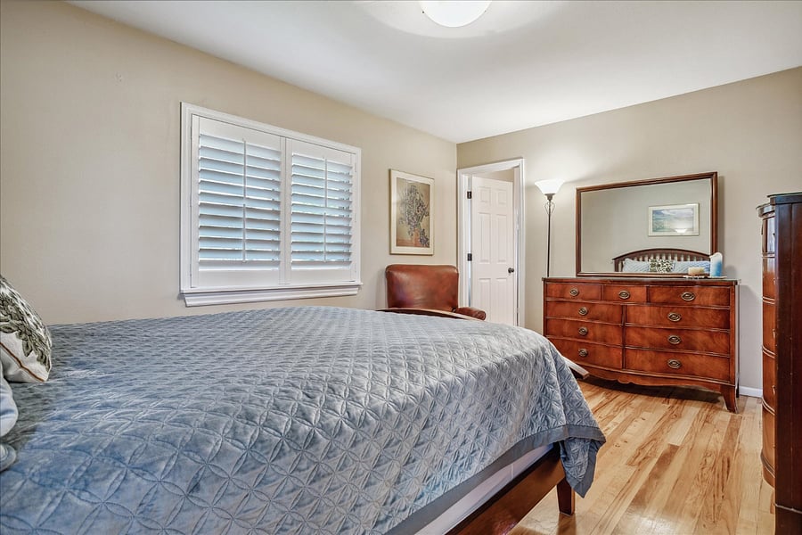 Another view of bedroom with Queen Sized Bed and bathroom.