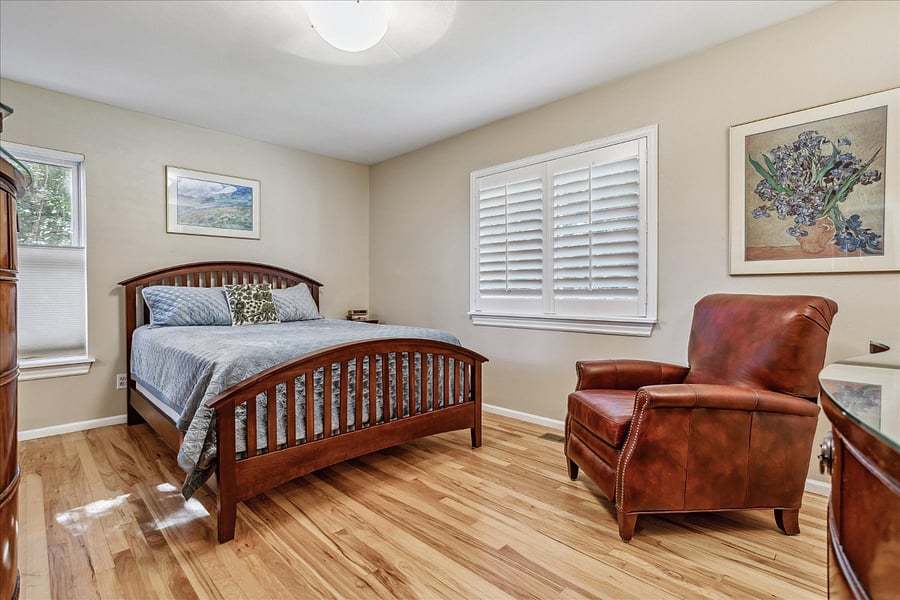 Bedroom with Queen Sized Bed private bathroom, & walk-in closet. Located on main level.