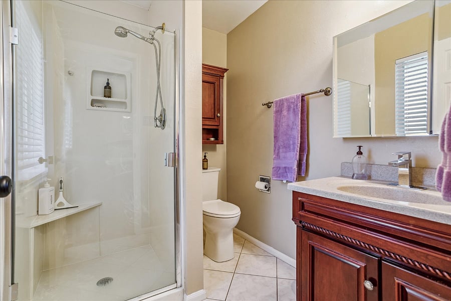 Adjoining Bathroom to Bedroom with Queen Sized Bed. Located on main level.