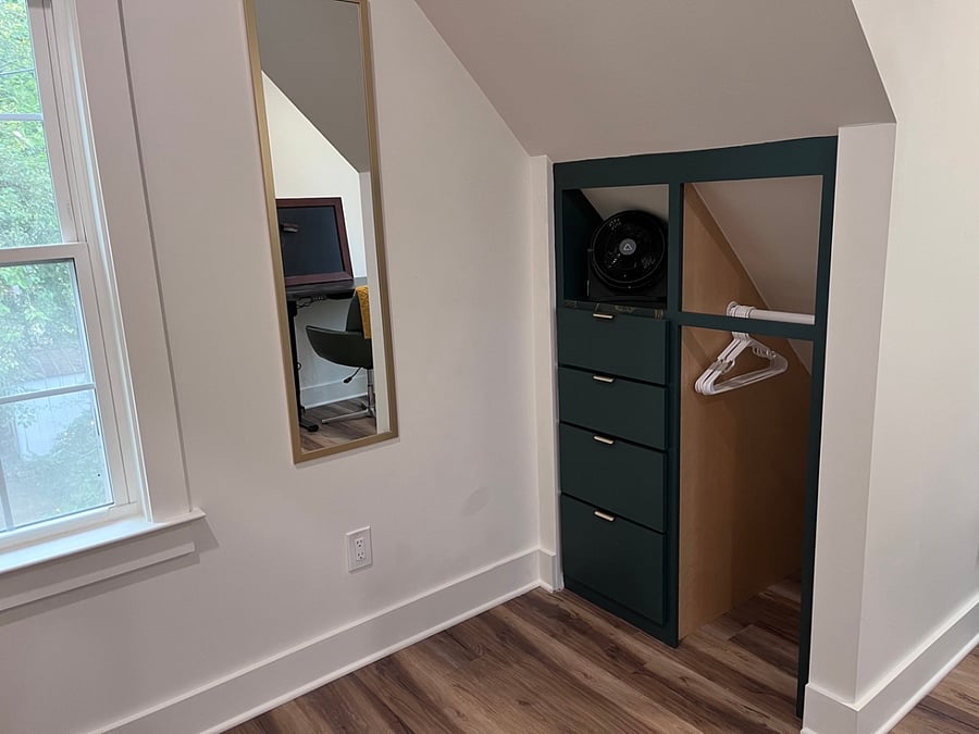 Across from the queen sized bed is a built in closet and dresser.  Like the kitchen built-in this dresser goes deeper each step down.  